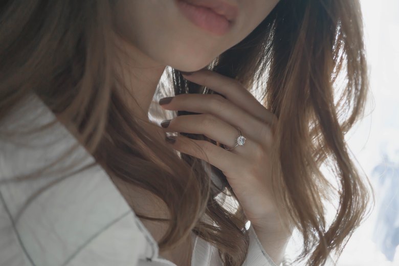 Lab-created diamond on woman's finger
