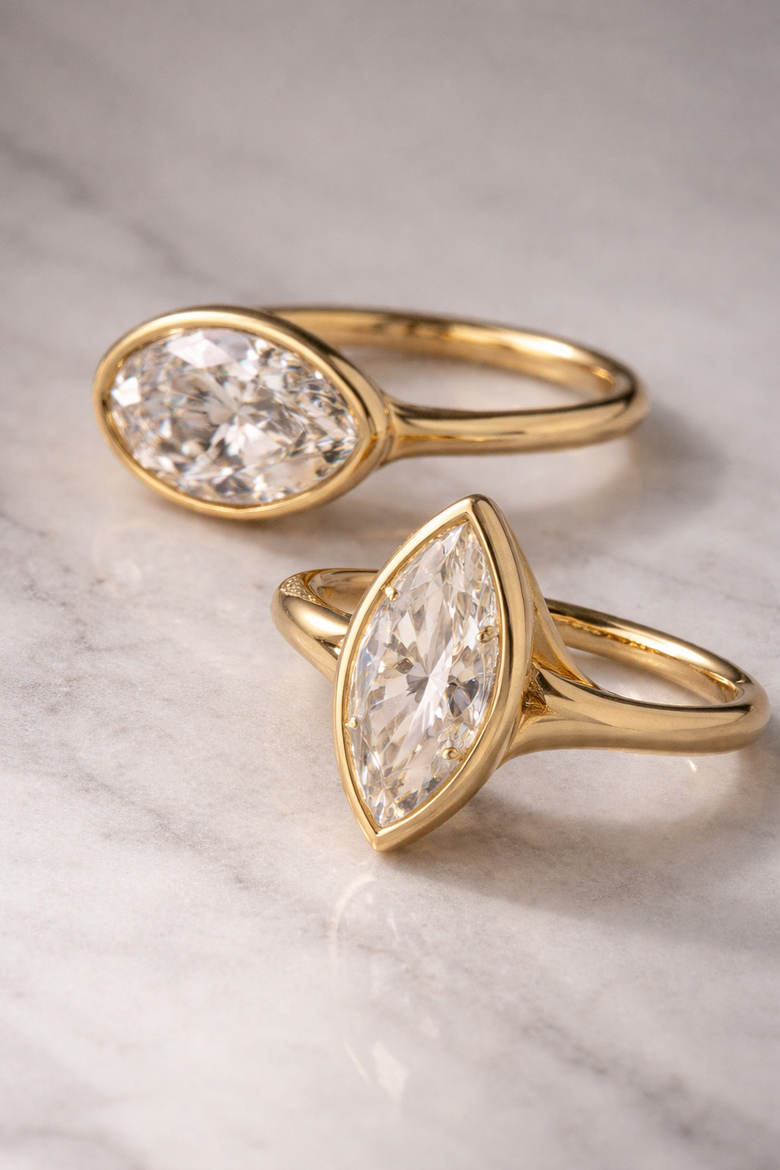 Instagram flat-lay photograph showing bezel engagement ring on marble surface with soft natural lighting and minimal styling, demonstrating the "high-engagement" aesthetic that performs well on social media - Shows readers exactly what makes bezel rings