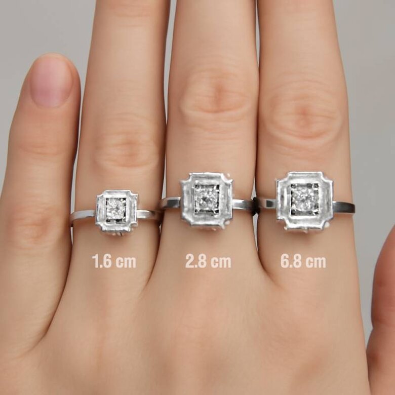 Image: Carat Weight Visual Size Comparison - Hand model wearing identical 1.5, 2.0, and 2.5-carat Asscher lab diamonds showing actual finger coverage and visual impact differences to guide size selection