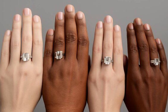 Image: Step Cut Shapes on Different Hand Types - Professional photography showing emerald, Asscher, and baguette cuts on various hand shapes to guide selection