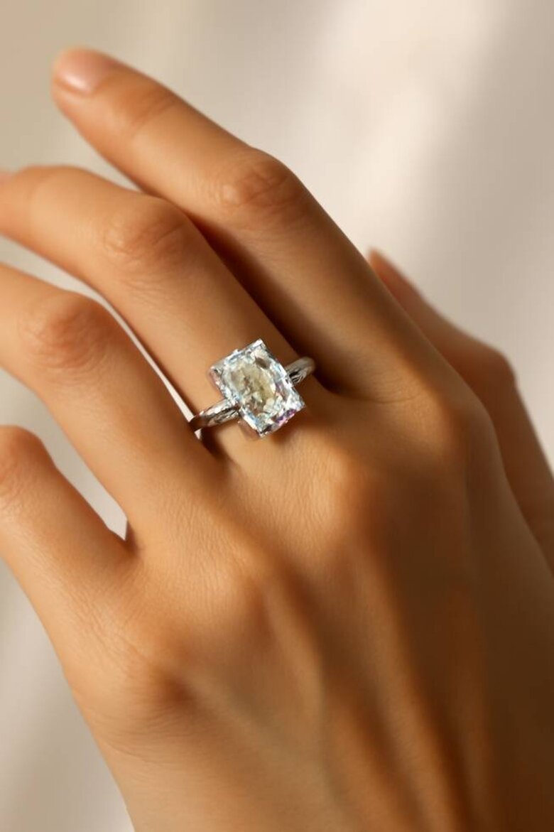 Image: Stunning Radiant Lab Grown Diamond Engagement Ring on Hand with Brilliant Light Dispersion - Visual demonstration of bold rectangular brilliance and modern luxury accessible to today