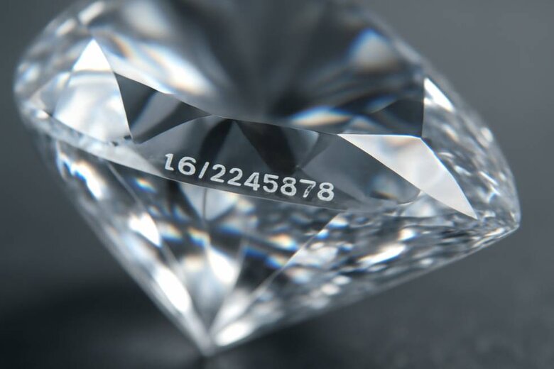 Image: Laser Inscription Under Magnification - Shows actual microscopic view of girdle inscription with certificate number, demonstrating verification method buyers can use