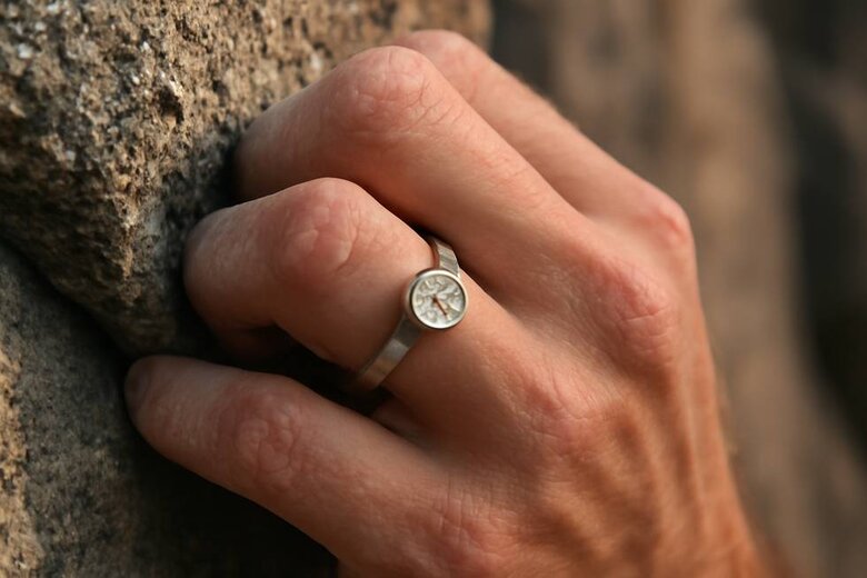 Image: Bezel-Set Lab Diamond Ring on Active Hand During Rock Climbing - Demonstrating Real-World Protection and Low-Profile Design During High-Impact Activities