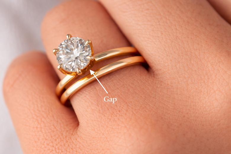 Cross-Section View of Straight Band vs Curved Band Fit - Visual demonstration showing how straight bands create gaps while curved bands achieve flush alignment against different engagement ring settings, including cathedral and high prong mountings
